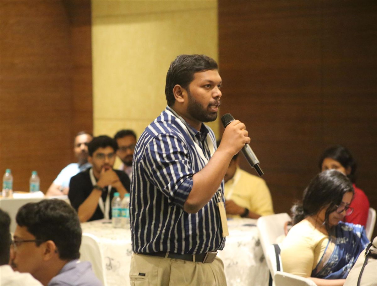 Biyas Muhammed asking a question at a conference