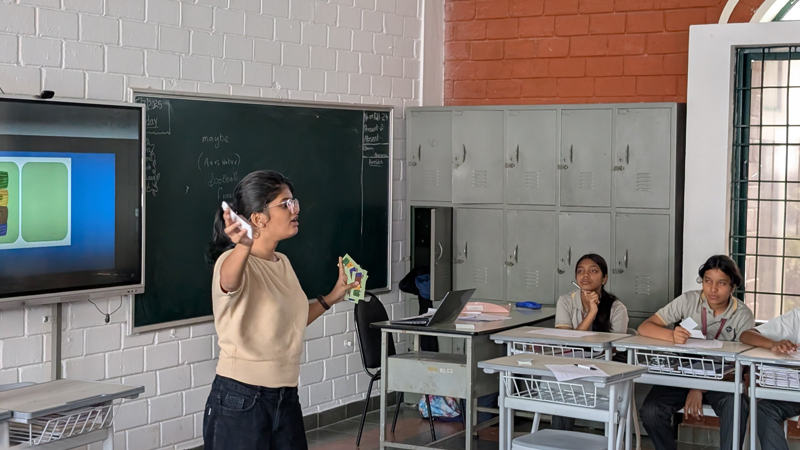 A facilitator leads a classroom session on climate change
