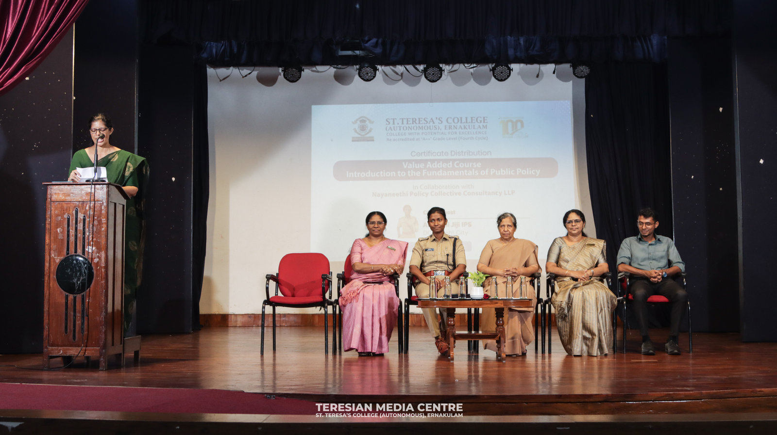 Guests on stage at the certification ceremony