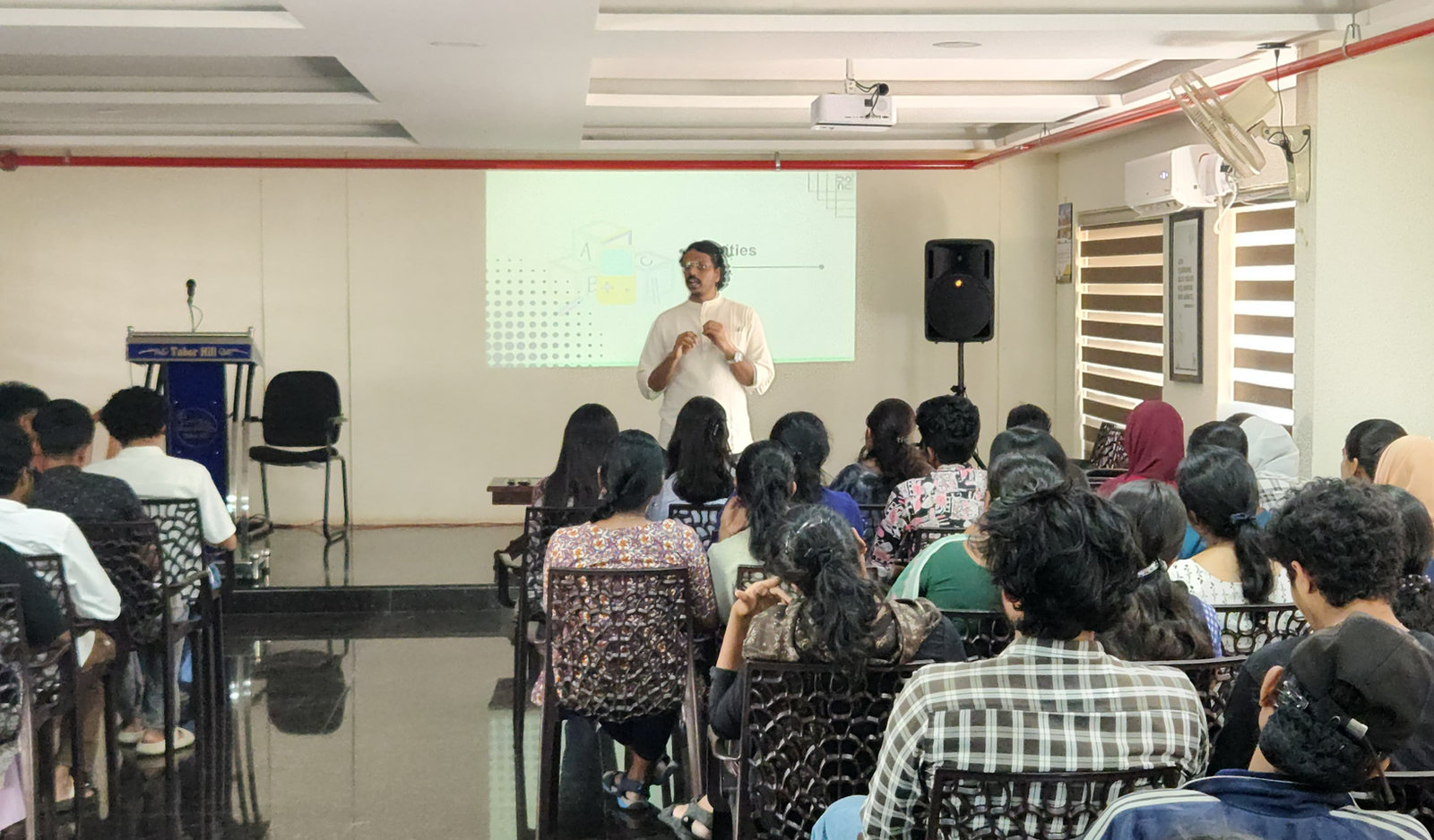 A training session for THRIVE volunteers in a college hall