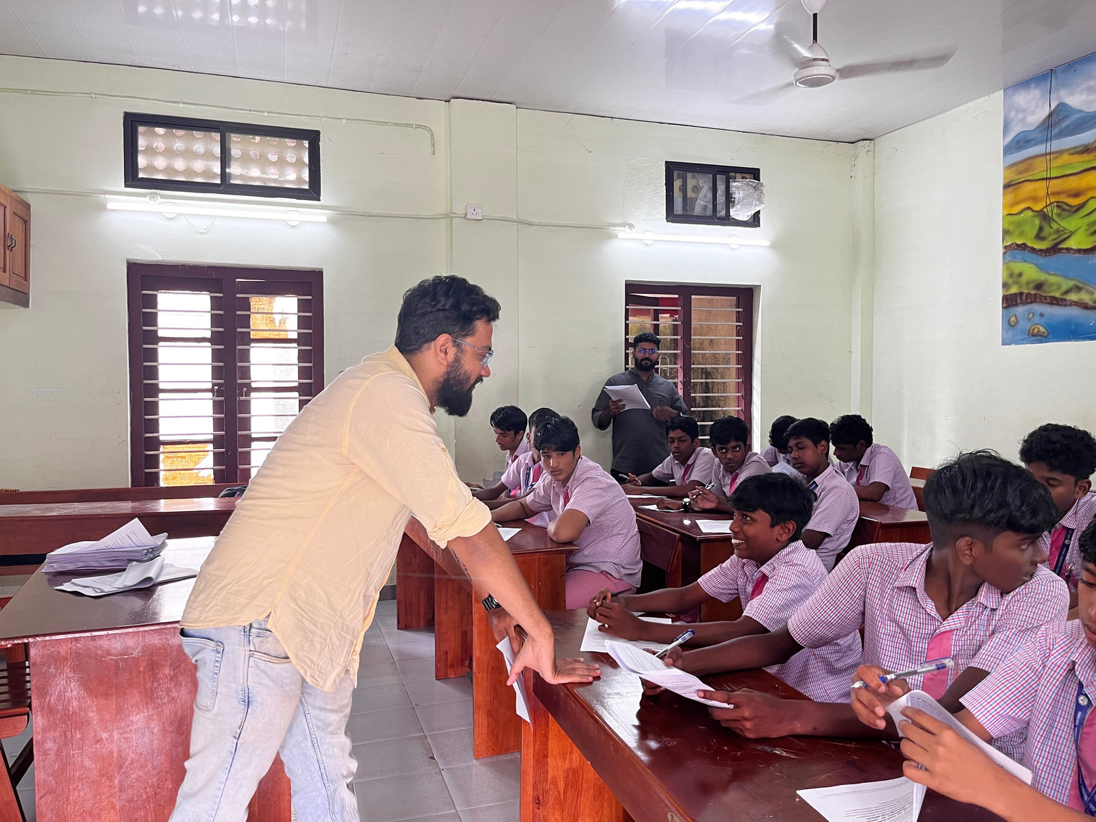 An NPoC researcher helps a student with the survey