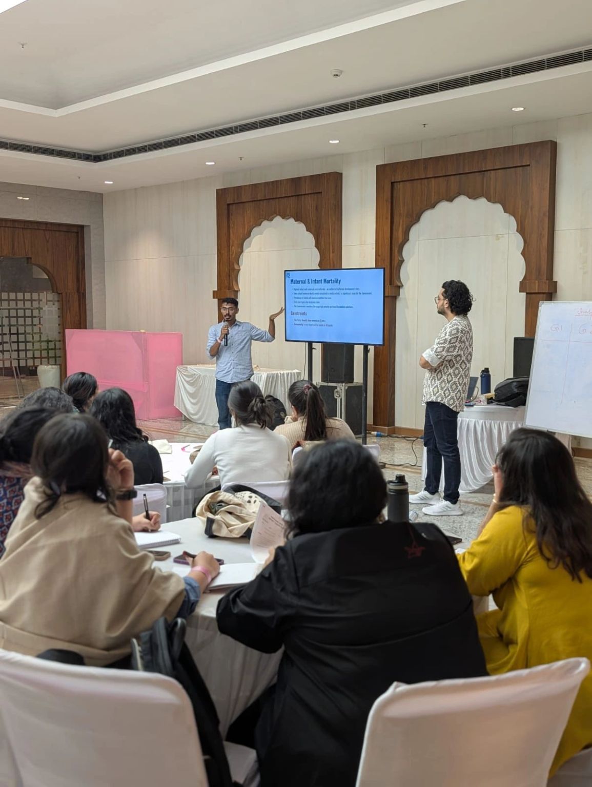 An NPoC co-founder facilitates the Society Solves game